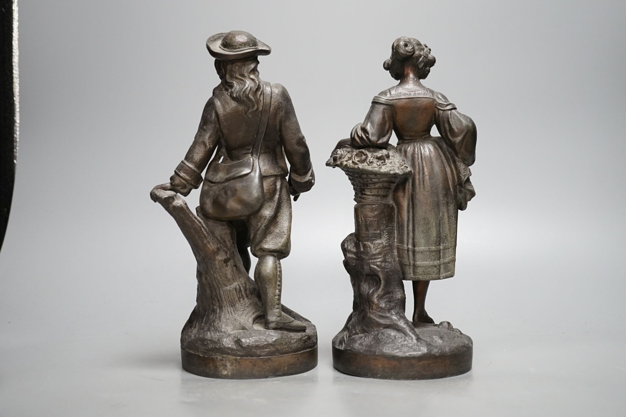 A pair of French cast metal figures, Hiver and Printemps, 25.5cm